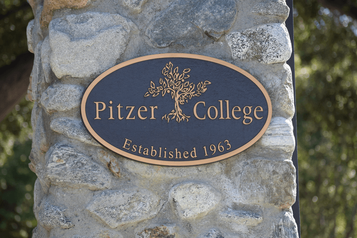Pitzer College plaque on gate
