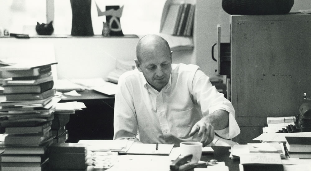 Founding faculty member Lee Munroe, professor of anthropology, in his office in 1969.