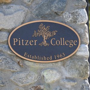 Pitzer College plaque on stone pillar