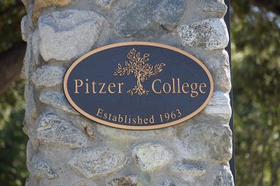 Pitzer College plaque on stone pillar