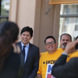 Kevin de León meets with supporters before the rally.