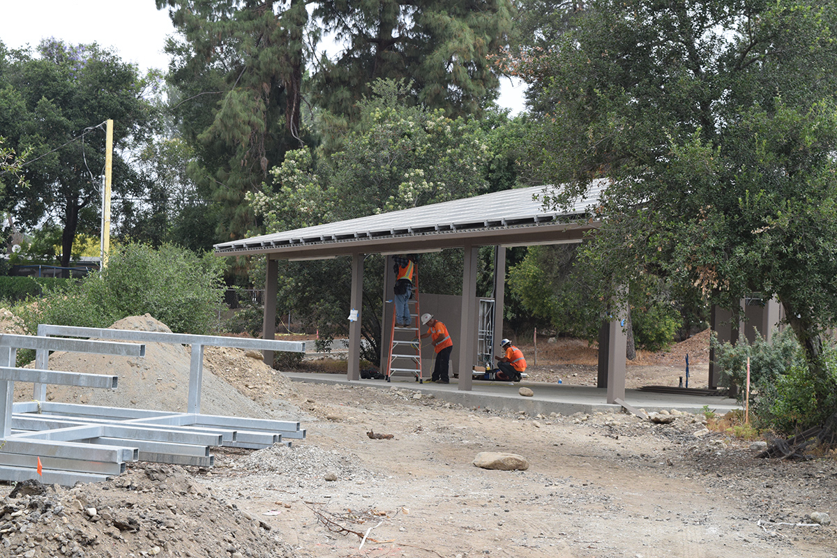 Construction of one of the outdoor classrooms with solar panels on the roof.
