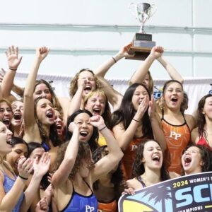 The Pomona-Pitzer women's swim team cheer and raise up the SCIAC trophy.