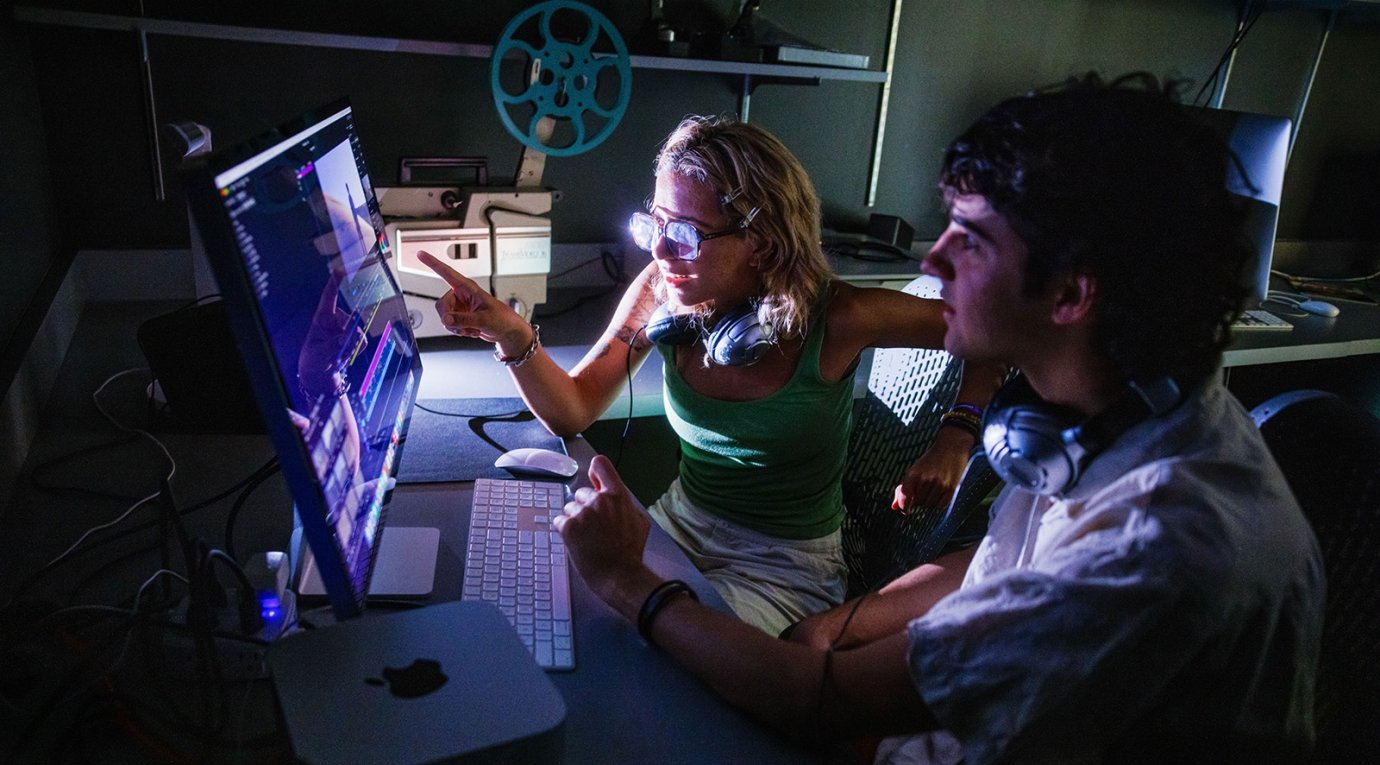 Two students edit film in Pitzer's editing room
