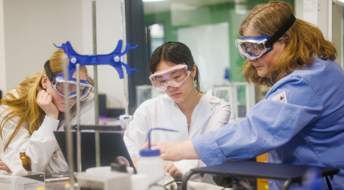 Three students perform an experiment