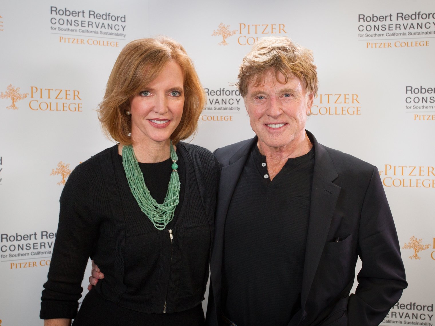 Robert Redford poses with Pitzer College president Laura Trombley