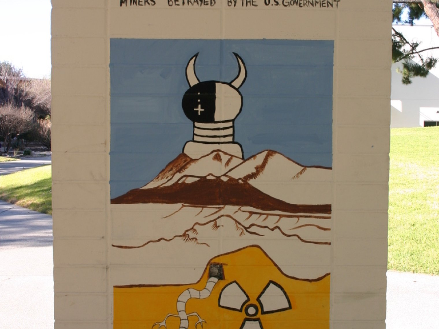 a painting of a desertscape with a mine underneath