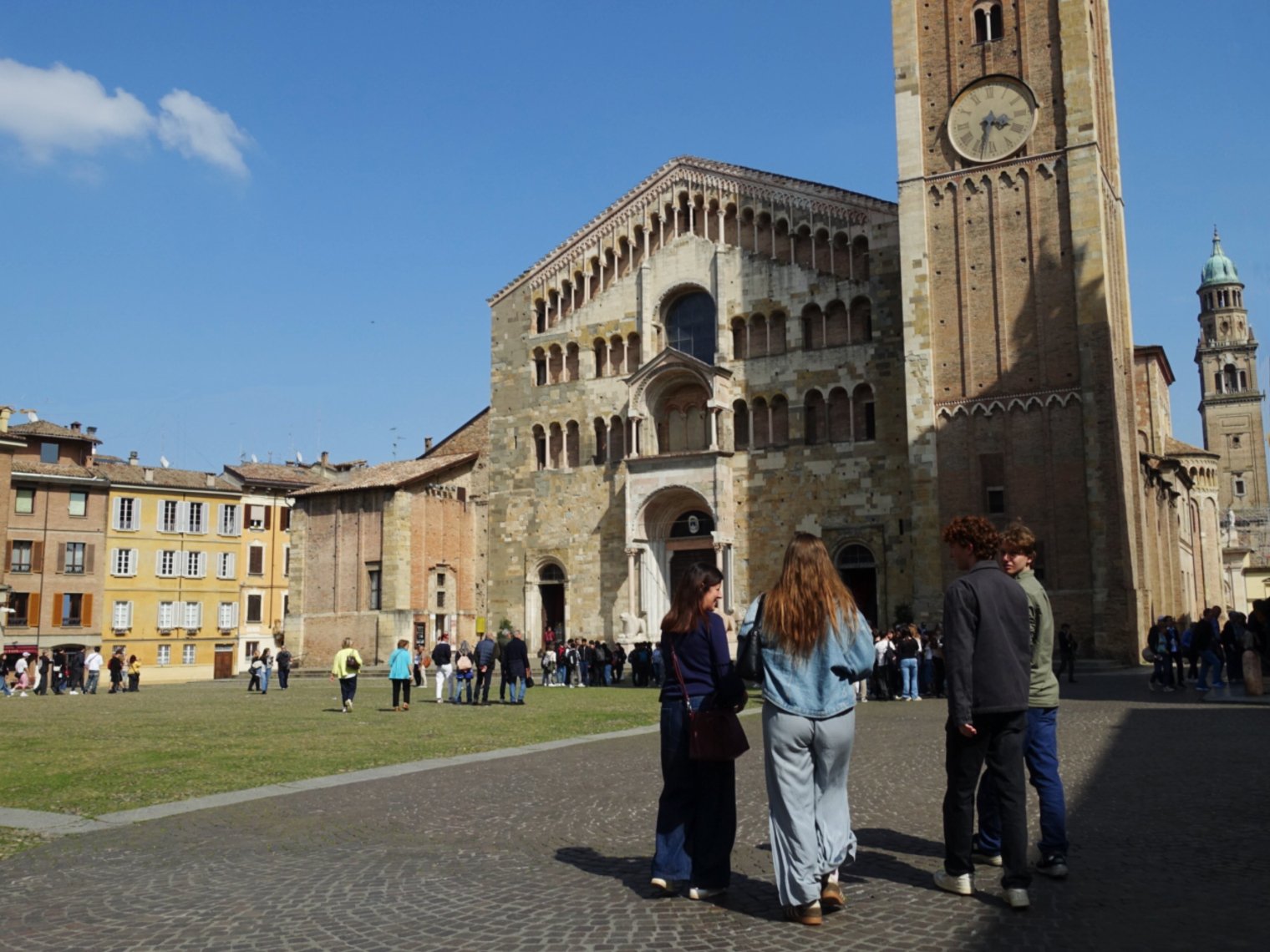 Students standing in front of bell tower