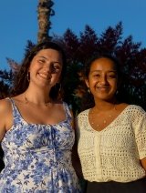 Events Board Co-Chairs standing in front of tress