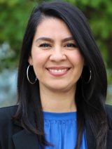 headshot of Cristal Hernandez wearing a blue blouse and black blazer