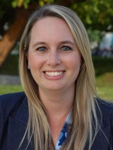Woman in blue blazer with long blonde hair.  