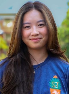portrait of Kaylene Yee wearing a blue strive to thrive shirt