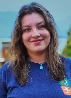 portrait of tessa spear wearing a strive2thrive blue shirt