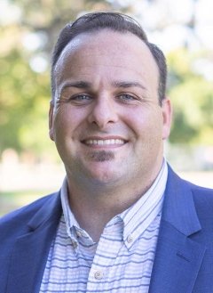headshot of Kyle Smith in an outdoor setting