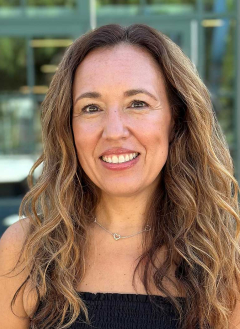 head shot of jaylene shoji standing in front of an office building