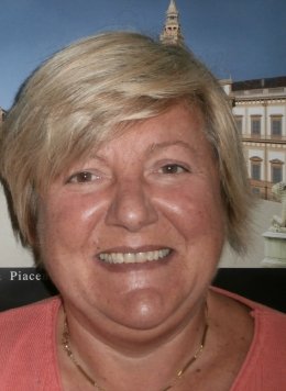 Person with short, blond hair in Italy