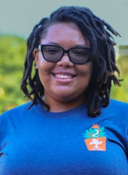 portrait of somari Beckett wearing a blue strive2thrive shirt