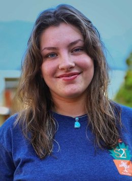 portrait of tessa spear wearing a strive2thrive blue shirt