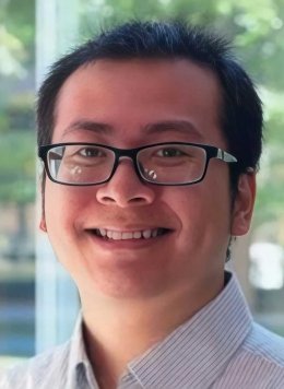 Trung Average Phan wearing button up and  black glasses