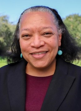 headshot of Chawne Kimber with the Pellessier Field behind her