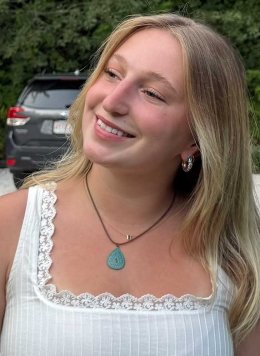 portrait of Zoe Sokatch wearing a white tank top.