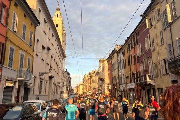People running through historic streets