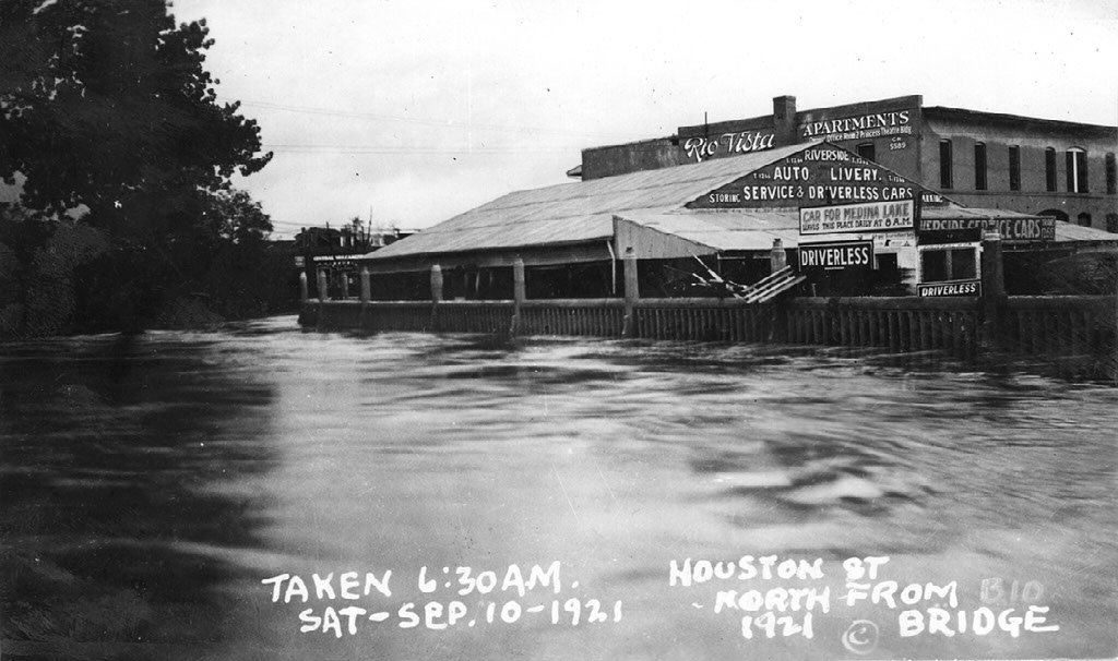 A monochromatic photo of a flooded street.