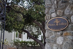 view of the pitzer gate and bronze plaque at the college's entrance