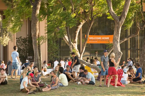 Students and parents on mounds sitting in 2016.