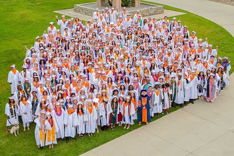 The Class of 2025 gathers near Brant Clock Tower during commencement