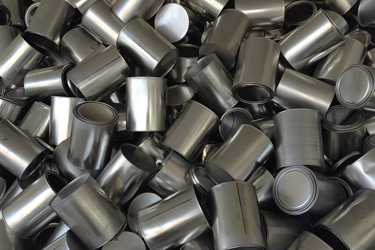 a pile of aluminum food cans
