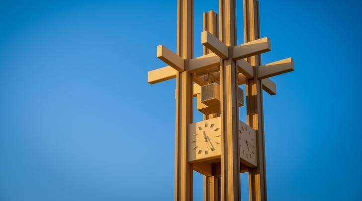 the brandt clock tower against a blue sky