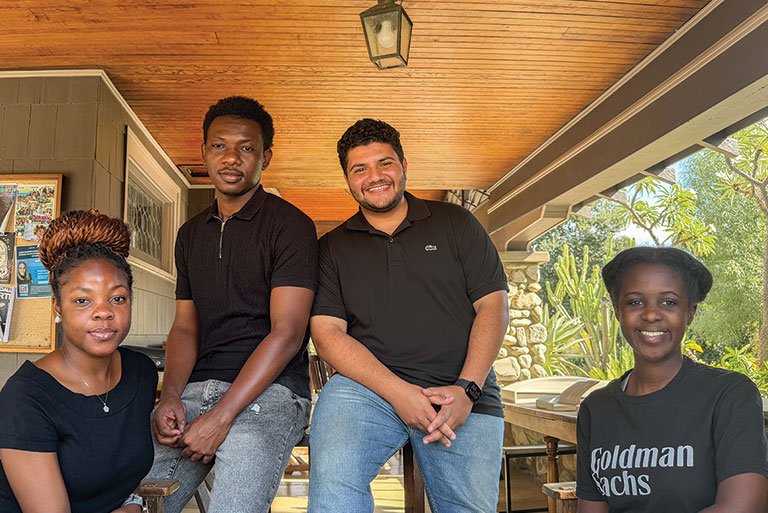 The founds of the Pitzer Connect tech club pose on the porch of the Grove House