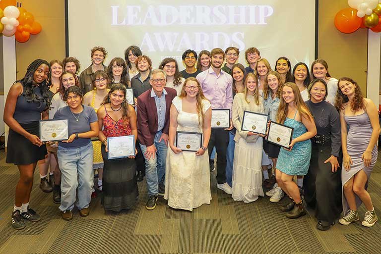 student awardees pose with President Strom Thacker