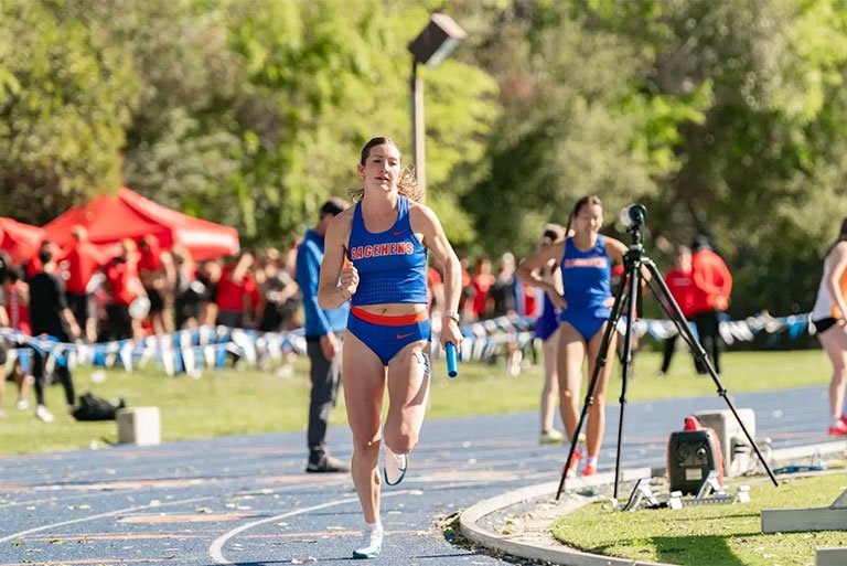 a student runnning in a track competition