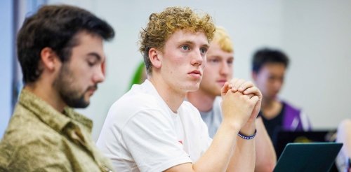 Student attentivley listens in class.