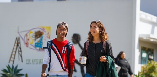 Two students walk to class