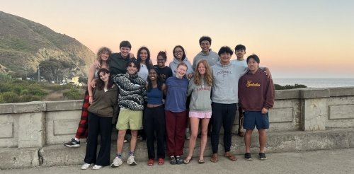 students standing at beach lookout