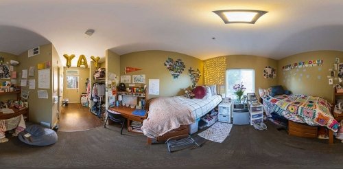 a fisheye view of a double occupancy pitzer dorm room decorated with student's personal belongings
