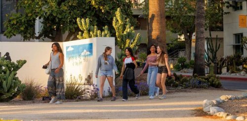 Students walk in Holden Garden outside Mead Hall