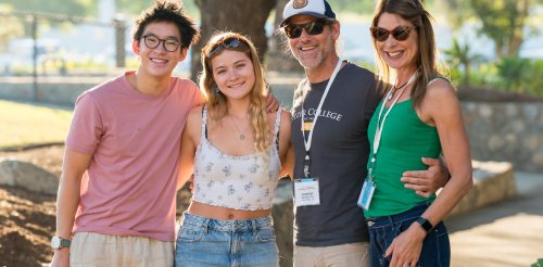 students and parents pose