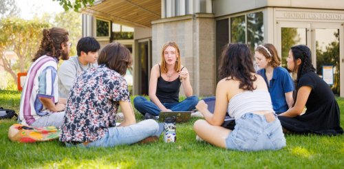 a study group sits in a circle on the mounds