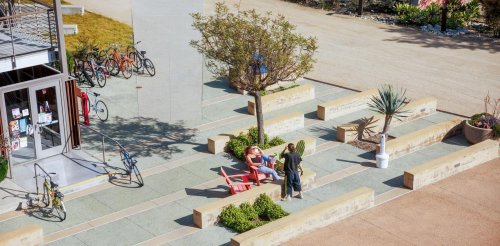 Two student chat outside of WES Hall