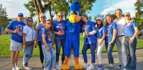 a group of sagehen fans pose with cecil the sagehen