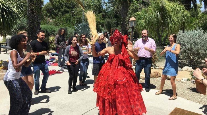 brazilian dancer performs in front of the grove house