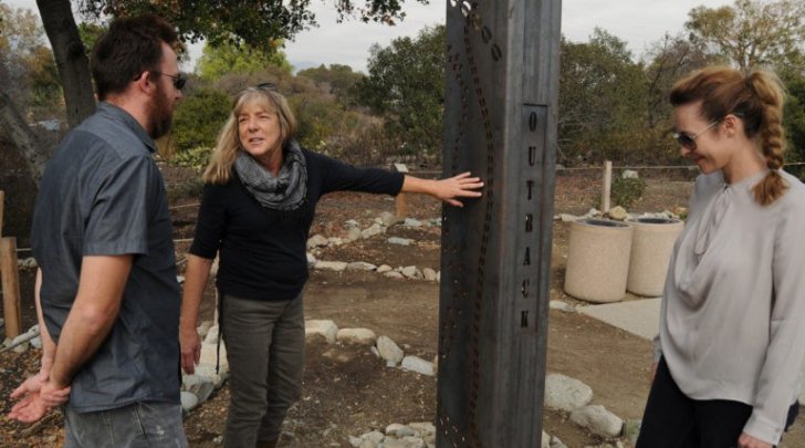 Kathryn Miller discusses her Outback sculpture with two art faculty