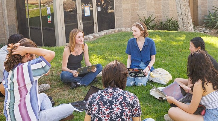 a study group sits in a circle on the mounds