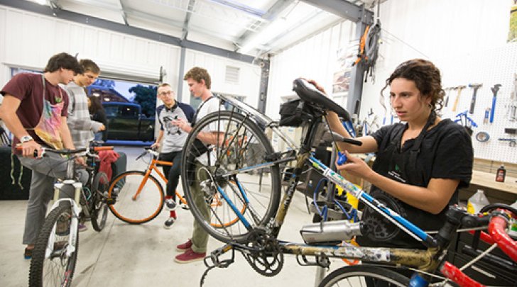 students inside the green bike program repairing bikes in 2014.