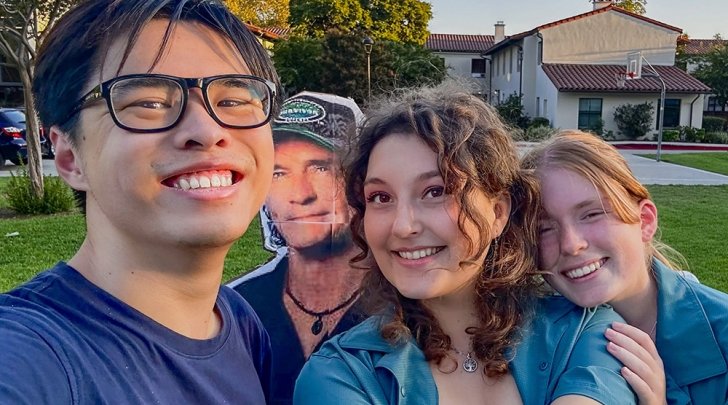 Students in the Claremont Survivor club pose with a cardboard cutout of Jeff Probst, the show's host