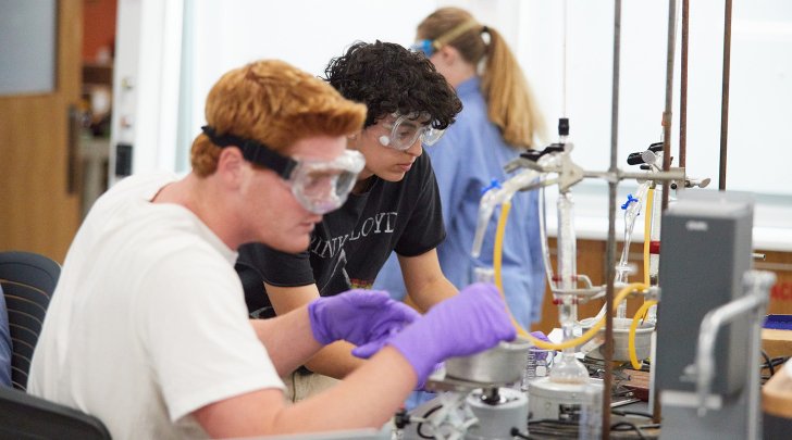Two students work together on an experiment